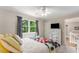 Comfortable bedroom with ceiling fan, large window and bright decor at 2401 Stockton Dr, Marietta, GA 30066