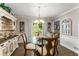 Bright dining room with a glass-top table, natural light, and classic decor at 2401 Stockton Dr, Marietta, GA 30066
