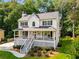 Beautiful two-story home boasting a classic design, inviting front porch and well-manicured lawn at 2401 Stockton Dr, Marietta, GA 30066