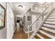 Inviting foyer with staircase, hardwood floors, and ample natural light at 2401 Stockton Dr, Marietta, GA 30066