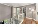 Bright hallway features hardwood floors, white trim, and staircase with white railing at 2401 Stockton Dr, Marietta, GA 30066