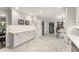Open kitchen layout with white cabinets, wine rack, and marble floors at 2401 Stockton Dr, Marietta, GA 30066
