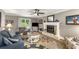 Comfortable living room with fireplace, ceiling fan, and ample natural light at 2401 Stockton Dr, Marietta, GA 30066