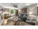 Cozy living room with fireplace, ceiling fan, and comfortable furnishings at 2401 Stockton Dr, Marietta, GA 30066