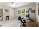 Bright home office boasts a window and a view; carpeted for comfort at 2401 Stockton Dr, Marietta, GA 30066