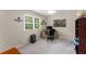 Well-lit home office features a desk, ceiling fan, and large window with view at 2401 Stockton Dr, Marietta, GA 30066