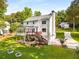 Spacious backyard with a deck, screened porch, garden beds, and a glimpse of the long driveway at 2401 Stockton Dr, Marietta, GA 30066