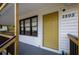 Close up of a yellow front door and the house number 2895, welcoming guests at 2895 Akron St, Atlanta, GA 30344