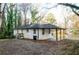 Rear exterior view of the home featuring a covered carport and a well-maintained yard at 2895 Akron St, Atlanta, GA 30344