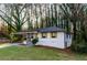 Inviting exterior showcasing a manicured lawn, carport, and freshly painted facade at 2895 Akron St, Atlanta, GA 30344