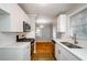 Modern kitchen featuring white cabinets, stainless steel appliances, and stylish backsplash at 2895 Akron St, Atlanta, GA 30344