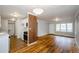 Open layout with hardwood floors connecting the living room, kitchen, and dining areas at 2895 Akron St, Atlanta, GA 30344