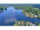A stunning aerial view showcasing lakefront properties surrounded by trees, offering tranquility and natural beauty at 4030 Greatwood Path, Alpharetta, GA 30005