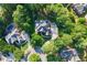 An aerial view of a beautifully landscaped home and backyard surrounded by trees at 4030 Greatwood Path, Alpharetta, GA 30005