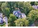 Aerial shot of a home nestled among mature trees in a quiet neighborhood at 4030 Greatwood Path, Alpharetta, GA 30005