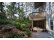 Lush backyard featuring a stone water feature and access to the deck at 4030 Greatwood Path, Alpharetta, GA 30005