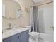 Bathroom features a vanity with marble countertop and a shower with a white tile surround at 4030 Greatwood Path, Alpharetta, GA 30005