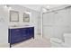 Bathroom featuring a double vanity with marble countertop and a glass enclosed shower at 4030 Greatwood Path, Alpharetta, GA 30005