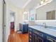 Bathroom boasts double vanity, marble countertop, and custom cabinets at 4030 Greatwood Path, Alpharetta, GA 30005