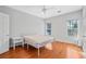Bedroom features hardwood floors, neutral paint, and natural light at 4030 Greatwood Path, Alpharetta, GA 30005