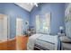Bedroom with vaulted ceiling, hardwood floors, and an ensuite bathroom at 4030 Greatwood Path, Alpharetta, GA 30005