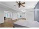 Bedroom with luxury vinyl plank floors opens up to a game room with a pool table at 4030 Greatwood Path, Alpharetta, GA 30005