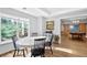 Eat-in dining area with lots of natural light, wood floors, and view of the game room at 4030 Greatwood Path, Alpharetta, GA 30005