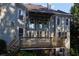 Rear exterior view of home, showcasing a multi-level deck and large windows at 4030 Greatwood Path, Alpharetta, GA 30005