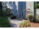 Exterior home view with a pathway and well-maintained landscaping at 4030 Greatwood Path, Alpharetta, GA 30005