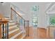 Spacious foyer with hardwood floors and staircase leading to the upper level at 4030 Greatwood Path, Alpharetta, GA 30005