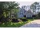 Charming two-story home with a well-manicured lawn and mature trees at 4030 Greatwood Path, Alpharetta, GA 30005