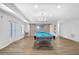 The game room has wood floors, access to the outside, a pool table, and a chandelier at 4030 Greatwood Path, Alpharetta, GA 30005