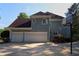 Home exterior with a two-car garage, basketball hoop and lots of parking space at 4030 Greatwood Path, Alpharetta, GA 30005