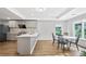 Bright kitchen features stainless steel appliances, modern cabinets, and lots of natural light at 4030 Greatwood Path, Alpharetta, GA 30005