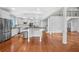 Spacious kitchen with island, stainless steel appliances, and adjacent living area at 4030 Greatwood Path, Alpharetta, GA 30005