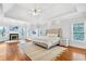 Spacious main bedroom suite with fireplace, sitting area, and tray ceiling at 4030 Greatwood Path, Alpharetta, GA 30005