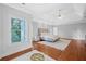 Spacious main bedroom features hardwood floors, tray ceiling, and natural light at 4030 Greatwood Path, Alpharetta, GA 30005