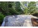 Spacious brick patio with seating area and basketball court, perfect for entertaining at 4030 Greatwood Path, Alpharetta, GA 30005