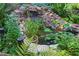 Charming pond with aquatic plants and rock details, creating a serene garden setting at 4030 Greatwood Path, Alpharetta, GA 30005