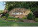 The stone entrance sign for Greatwood is surrounded by landscaped features and is a beautiful landmark at 4030 Greatwood Path, Alpharetta, GA 30005