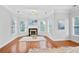 Cozy sitting area with fireplace, windows, and natural light at 4030 Greatwood Path, Alpharetta, GA 30005