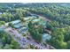 Aerial view of a community tennis court complex featuring multiple well-maintained courts and ample parking at 4030 Greatwood Path, Alpharetta, GA 30005