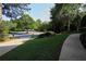 Sidewalk and well-maintained lawn in a quiet neighborhood with mature trees at 4030 Greatwood Path, Alpharetta, GA 30005