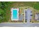 Aerial view of a community pool with lounge chairs and parking area at 4189 Brookmont Way, Auburn, GA 30011