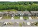 Aerial view of a neighborhood showcasing well-maintained homes and greenery, highlighting community living at 4189 Brookmont Way, Auburn, GA 30011