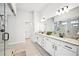 Bright and modern bathroom with double vanity, granite countertops, and glass enclosed shower at 4189 Brookmont Way, Auburn, GA 30011