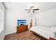 Comfortable bedroom with a ceiling fan, natural light, hardwood floors, and a spacious layout at 4189 Brookmont Way, Auburn, GA 30011