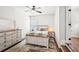 Comfortable bedroom with a whitewashed dresser and a view to the wood-look staircase at 4189 Brookmont Way, Auburn, GA 30011