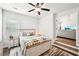 Bedroom featuring neutral décor and a peak into the brightly lit living room at 4189 Brookmont Way, Auburn, GA 30011