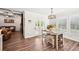 Breakfast nook with hardwood floors and seamless connection to a covered porch and living area at 4189 Brookmont Way, Auburn, GA 30011